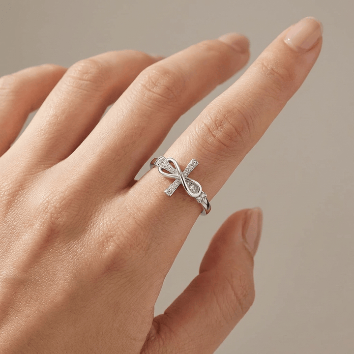 Adjustable Silver Cross and Bow Ring
