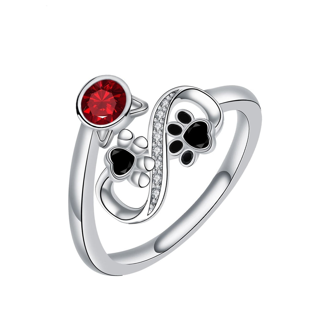 Adjustable Ring with Black Accents and Red Gemstone