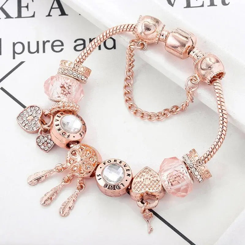 Pink Dream Catcher Bracelet with Silver Charms" can be rewritten as:

"Charming Pink Dream Catcher Bracelet with Silver Accents