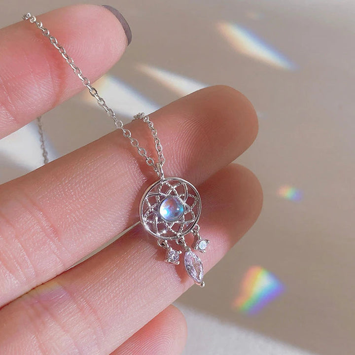 Silver Moon Crystal Dreamcatcher Necklace" can be rewritten as "Silver Dreamcatcher Necklace with Moon Crystal.
