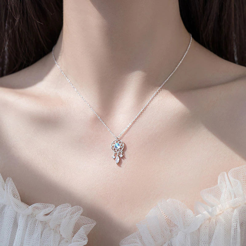 Silver Moon Crystal Dreamcatcher Necklace" can be rewritten as "Silver Dreamcatcher Necklace with Moon Crystal.