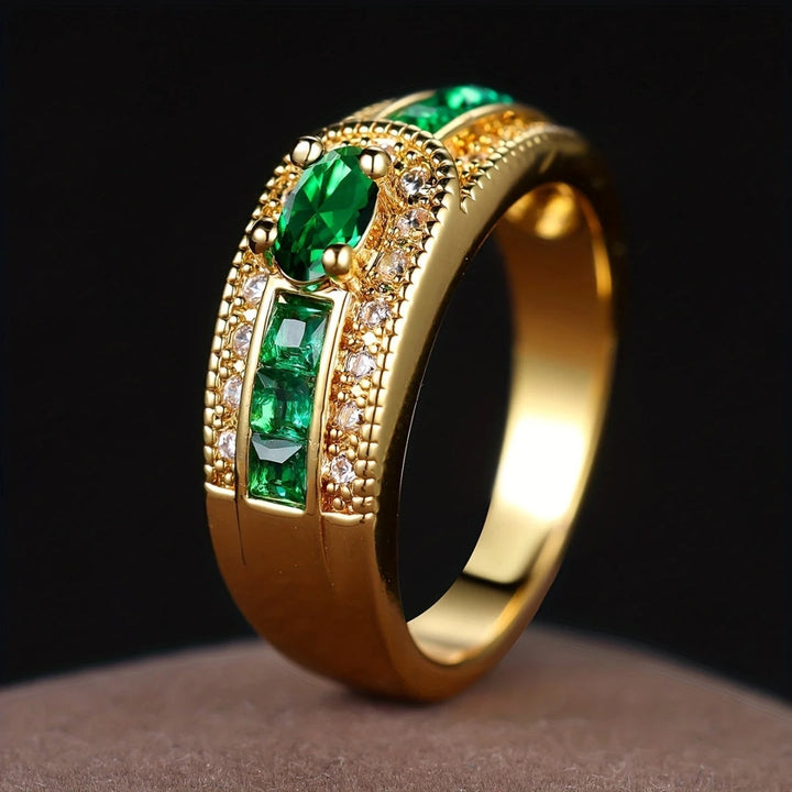 Sparkling Gold Ring with Green Accent