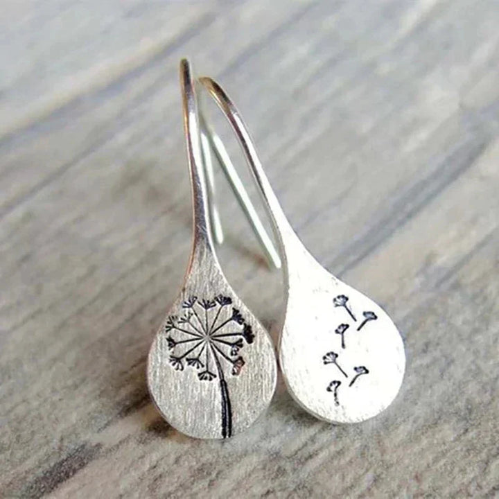 Exclusive Silver Dandelion Leaf Earrings" can be rewritten as "Unique Silver Dandelion Leaf Earrings.