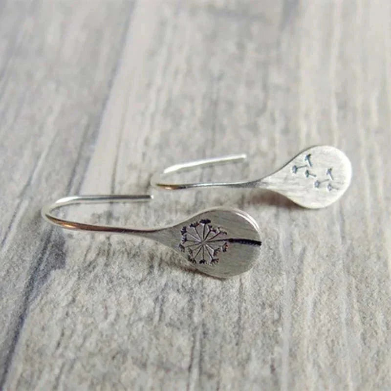 Exclusive Silver Dandelion Leaf Earrings" can be rewritten as "Unique Silver Dandelion Leaf Earrings.