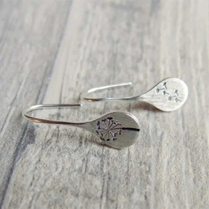 Exclusive Silver Dandelion Leaf Earrings" can be rewritten as "Unique Silver Dandelion Leaf Earrings.