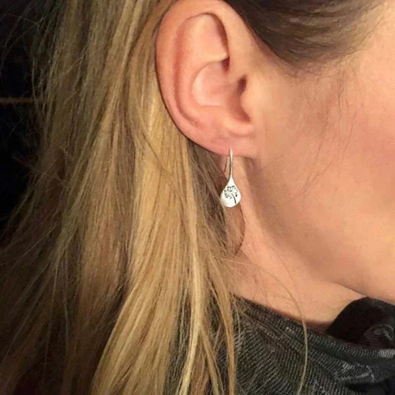 Exclusive Silver Dandelion Leaf Earrings" can be rewritten as "Unique Silver Dandelion Leaf Earrings.