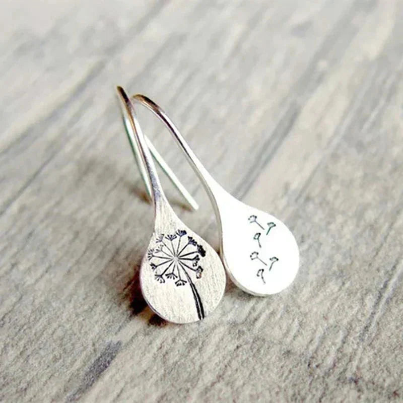 Exclusive Silver Dandelion Leaf Earrings" can be rewritten as "Unique Silver Dandelion Leaf Earrings.