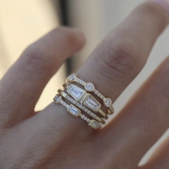 Square Zircon Ring with Four Diamonds" can be rewritten as: 

"Square Zircon Ring Featuring Four Diamonds