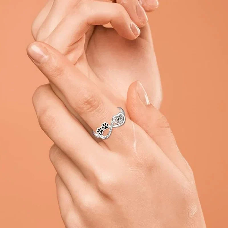 Paw-Shaped Ring Adorned with Zirconia Hearts and Infinity Design