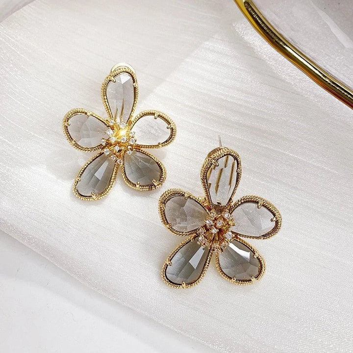 Rotating Zirconia Inlay Earrings with Floral Design