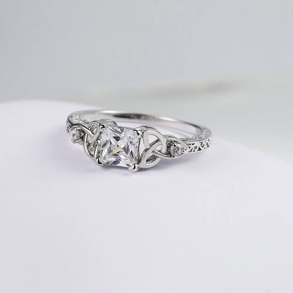 Knot Design Ring with Silver Gemstone Center