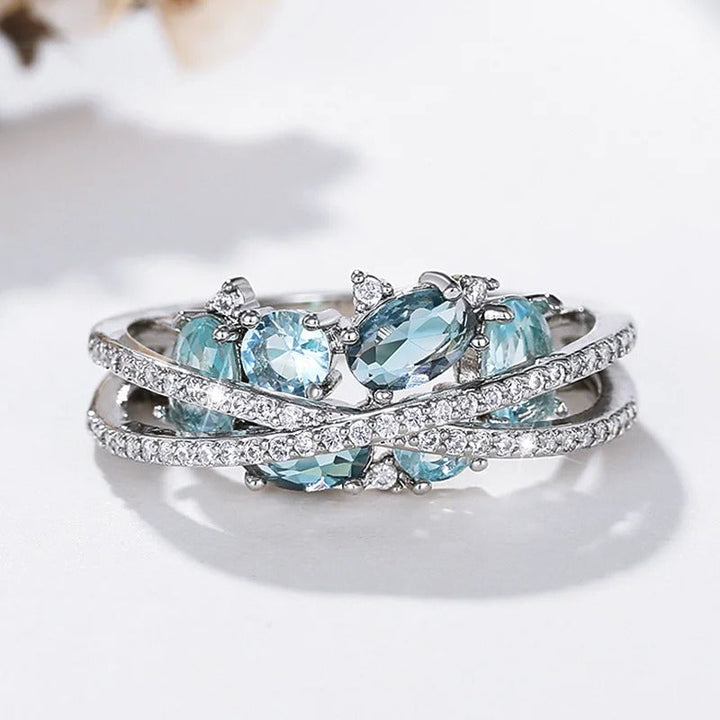 Silver Cross Ring with Blue Gemstone